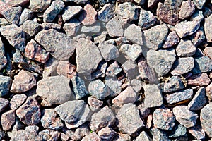 Background of stony pebbles. Small stones of the sea beach