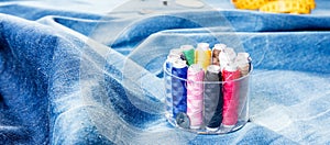 Background table top view of sewing tool and jeans on denim fabric