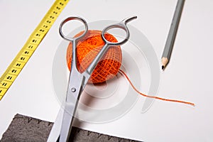 Background for tailor orange thread and sewing tools