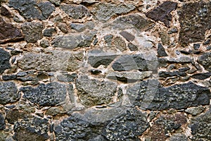 Background, texture - ancient masonry at the wall of the castle