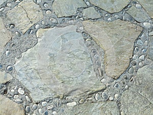 Background texture of ancient round gray stone floor