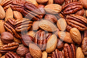 Background texture of assorted mixed nuts including cashew, peca photo