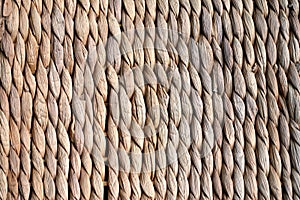 Background texture of beige or straw colored wicker or seagrass photo
