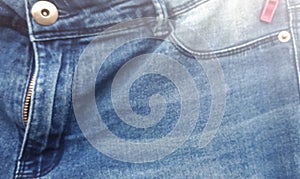 Background texture of blue jeans in blur. fabric