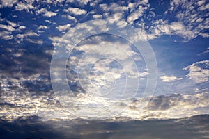 Background and texture of bright blue sky and cotton clouds with sun lights on afternoon summer