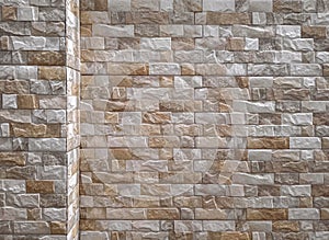 Background and texture of brown and white composite stone brick fence wall
