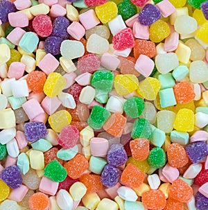 Background texture - close up of pastel butter mints and bright gumdrops