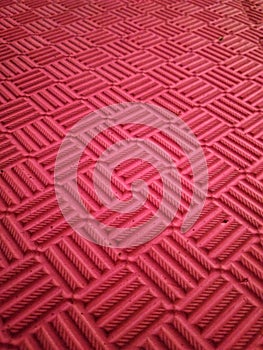 background texture of a close-up view of the pattern of a sports mat with a striped pattern