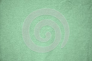 Background, texture, colored green fabric textile matt photo