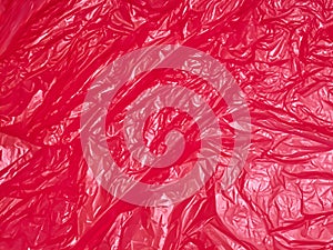 background texture of crumpled red plastic