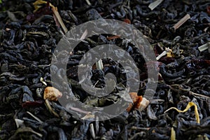 Background, texture of dried tea leaves. Macro texture background of dried, raw white tea leaves frame filling flat lay from above