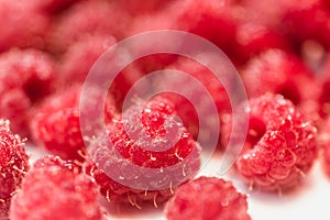Background texture of dripping raspberry.