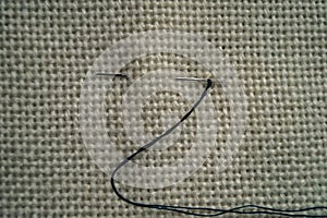 Background texture fabric canvas with needle and thread