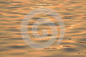 Background Texture of flowing Ganges river waters at sunrise