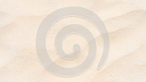 Background and texture, full frame of fine beach sand backgroubd.