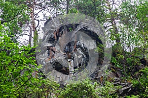 Background texture of a gray brown stone on the rock of the mountain discovered during archaeological excavations as a monument to