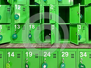 Background texture: green lockers in the locker room. Lockers in a public locker room. Luggage storage in the store