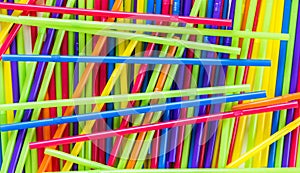 Background texture-jumbled pile of colorful plastic straws