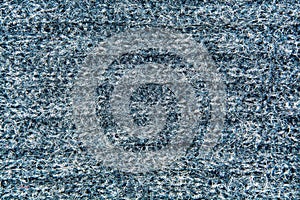 Background, texture of a knitted gray fabric closeup