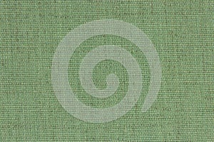 Background, texture, light green color wicker textile material, closeup. The structure of olive fabric with a natural