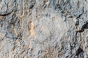 Background and texture of mountain layers and cracks in sedimentary rock on cliff face. Cliff of rock mountain.