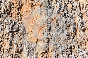 Background and texture of mountain layers and cracks in sedimentary rock on cliff face. Cliff of rock mountain.