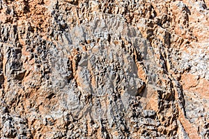 Background and texture of mountain layers and cracks in sedimentary rock on cliff face. Cliff of rock mountain.