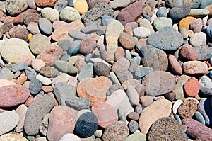 Background texture of multi colored beach stones