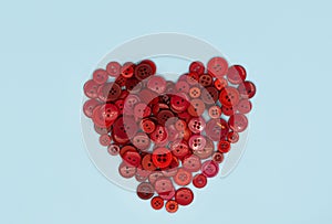 Background and texture of multicolored vintage buttons. in the shape of a heart