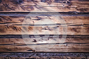 Background with the texture of an old brushed deified wood.