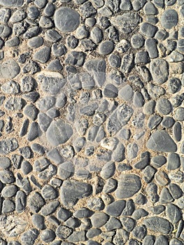 Background texture of old cobblestone road surface