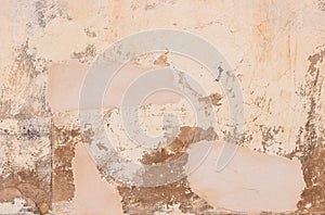 Ancient damaged plaster wall background texture, close-up