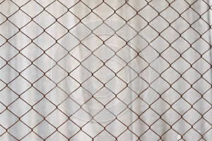 Background texture of an old rusty mesh Rabitz