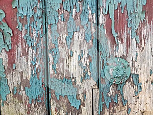 Background texture old wooden door with brown green broken paint