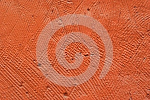 Background, texture: orange roughly plastered wall