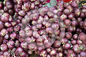 Background and texture of organic red onions.