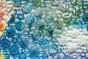 Background texture; pattern. Cloth with glued lace stripes. Multicolored lace with sparkles; cording and metallic embroidery. photo