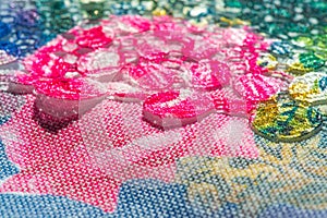 Background texture; pattern. Cloth with glued lace stripes. Multicolored lace with sparkles; cording and metallic embroidery. photo