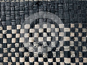 The background texture and pattern of the floor mat are made from white and dark blue patchwork