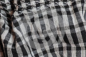 Background texture, pattern. Scarf wool like Yasser Arafat. The Palestinian keffiyeh is a gender-neutral checkered black and white