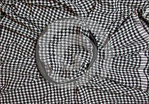 Background texture, pattern. Scarf wool like Yasser Arafat. The Palestinian keffiyeh is a gender-neutral checkered black and white