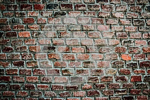 Background, texture pattern of a wall of old red bricks