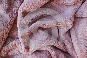 Background texture of pink soft touch fabric with folds.