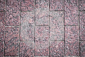 Background. Texture of red rectangular marble tiles on the whole frame. Horizontal frame photo