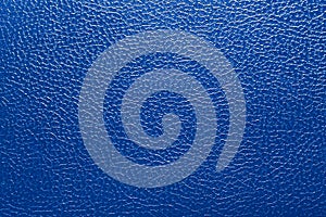 Background texture rippled surface under skin dark blue color