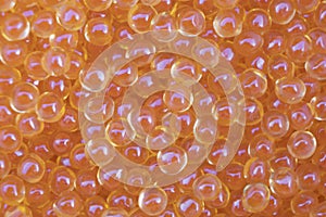 Background texture of salmon fish red caviar. Macro shot trout caviar texture pattern