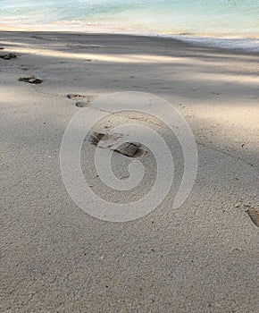 Background, texture of sand, footprints in the sand