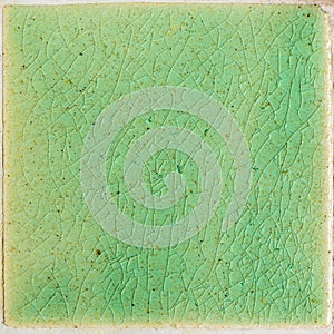 Background and texture of stretch marks cracked on emerald green glazed tile