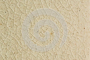 Background and texture of stretch marks cracked on white cream glazed tile