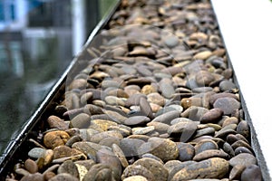 Background texture of swimming pool/garden pile of pebbles